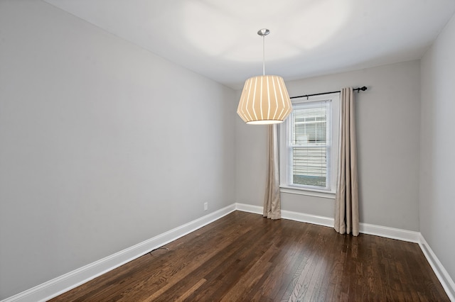 unfurnished room featuring dark hardwood / wood-style flooring