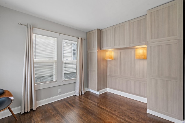 unfurnished room featuring dark hardwood / wood-style flooring