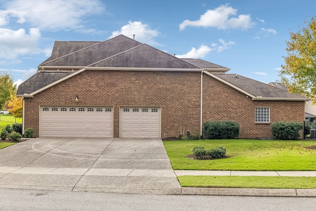 view of home's exterior featuring a garage and a yard