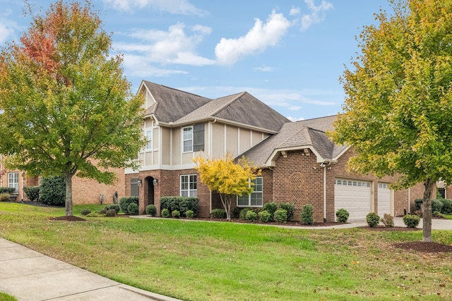 view of front of home featuring a front lawn and a garage