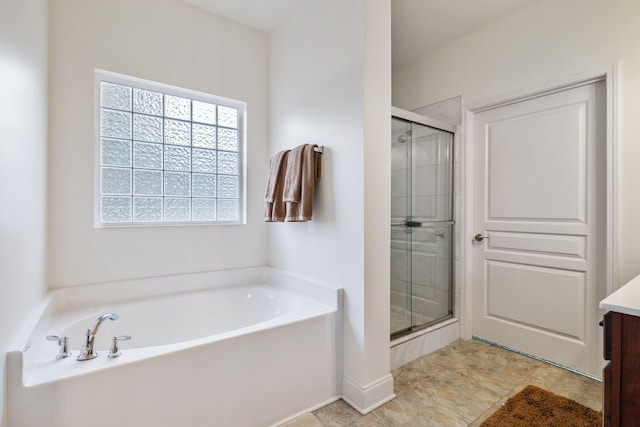 bathroom featuring separate shower and tub and vanity