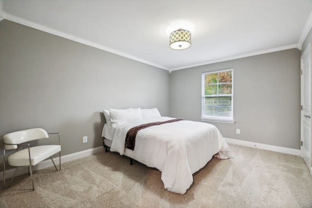 bedroom with light colored carpet and crown molding