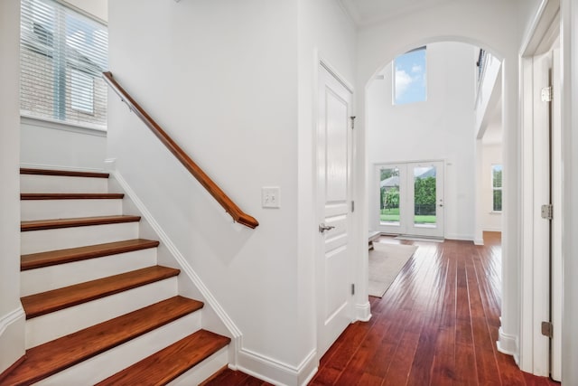 staircase with hardwood / wood-style flooring