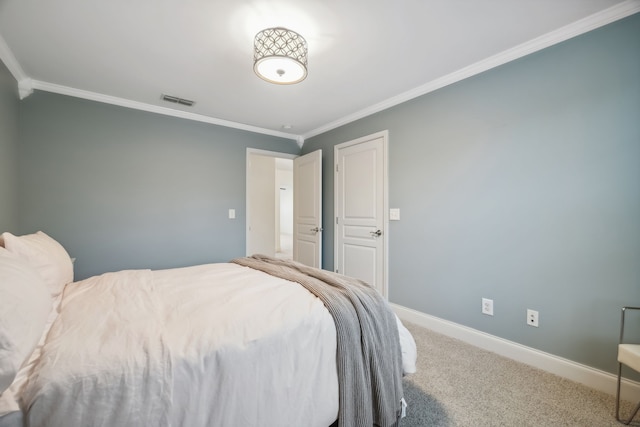 bedroom featuring crown molding and carpet floors