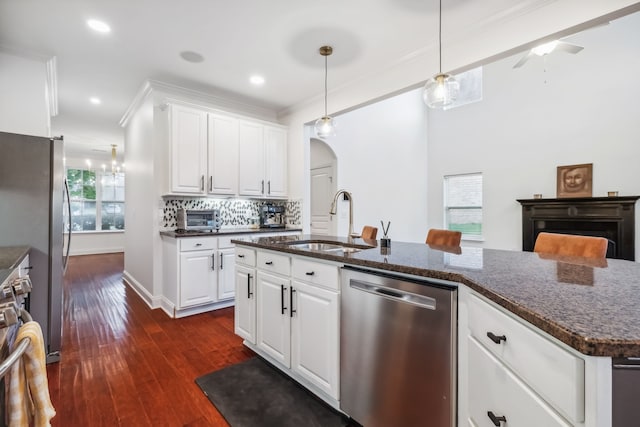 kitchen featuring white cabinets, plenty of natural light, sink, and appliances with stainless steel finishes