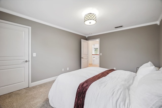 bedroom featuring carpet flooring and crown molding