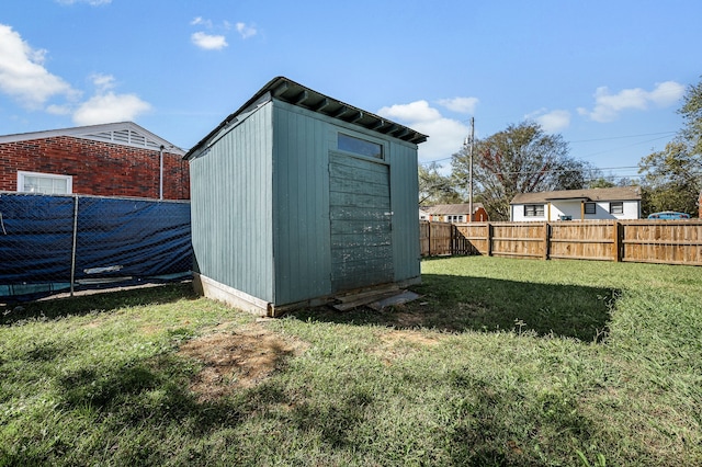 view of outdoor structure with a lawn