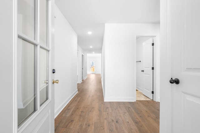 corridor featuring light hardwood / wood-style floors