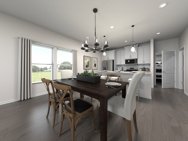 dining area with a chandelier and dark hardwood / wood-style floors