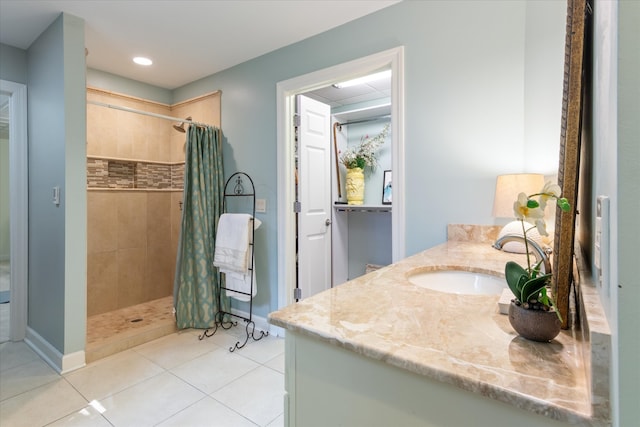 bathroom featuring vanity, tile patterned floors, and walk in shower