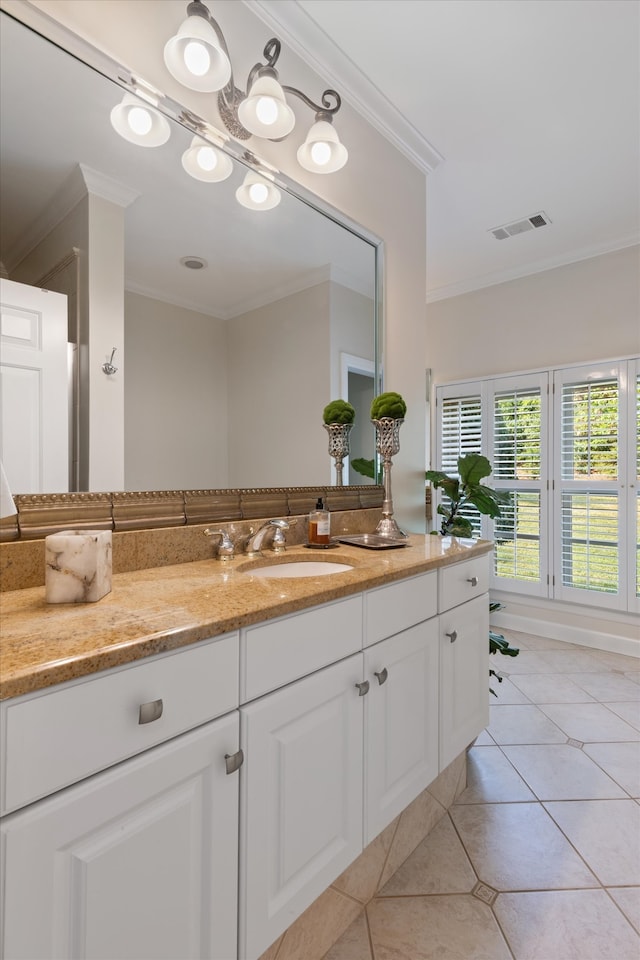 bathroom with vanity, tile patterned floors, and crown molding