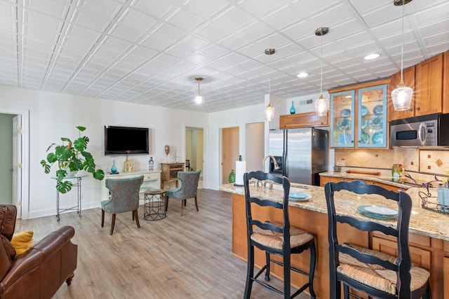 dining space featuring light hardwood / wood-style floors