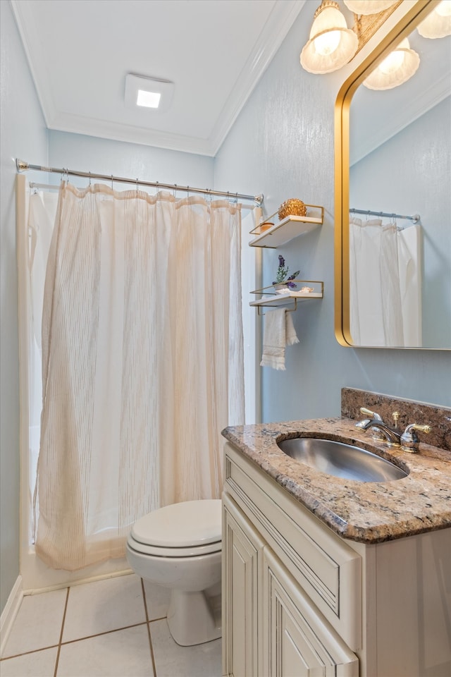 bathroom with toilet, vanity, tile patterned floors, and ornamental molding