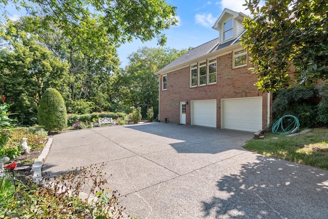 view of property exterior with a garage