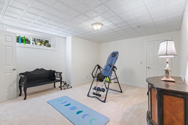 exercise room with light colored carpet