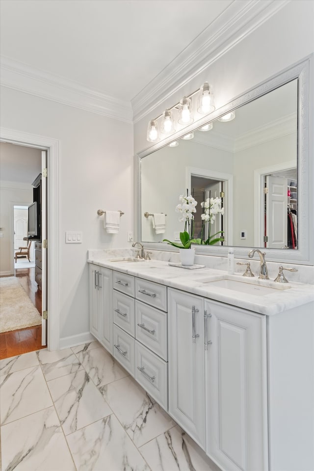 bathroom featuring hardwood / wood-style floors, vanity, and ornamental molding