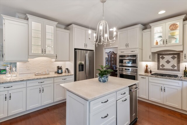 kitchen with white cabinets and appliances with stainless steel finishes