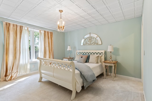 carpeted bedroom with a notable chandelier