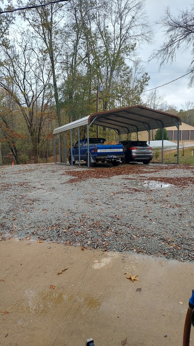 view of vehicle parking with a carport