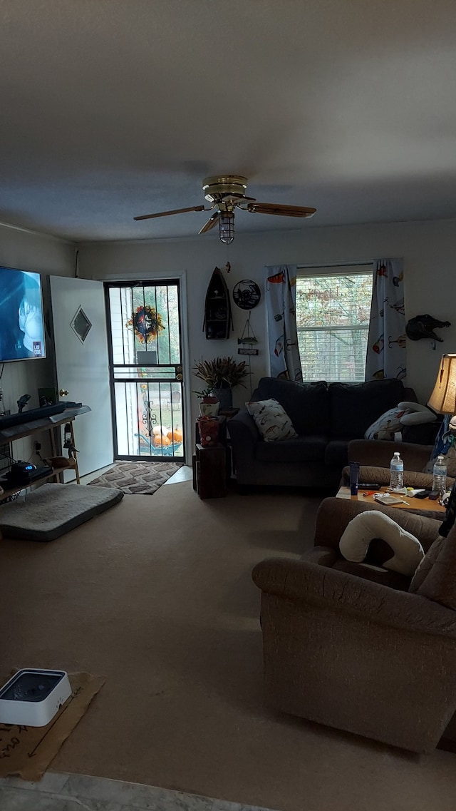 living room with carpet flooring and ceiling fan