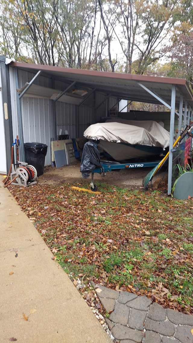 view of vehicle parking with a carport