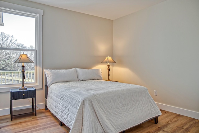 bedroom with hardwood / wood-style flooring