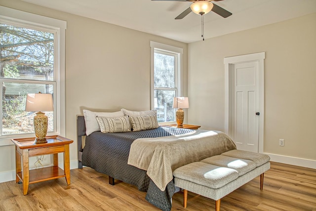 bedroom featuring light hardwood / wood-style floors and ceiling fan