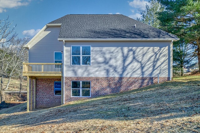 rear view of house with a lawn