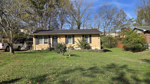 ranch-style home with a front yard