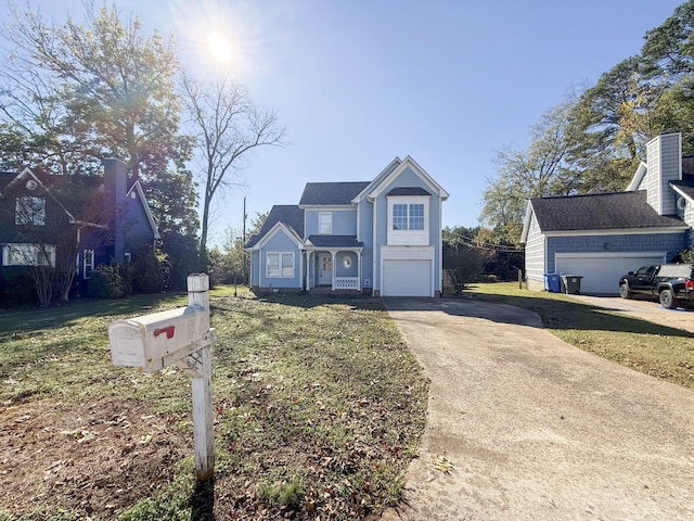 view of front of home with a garage and a front yard