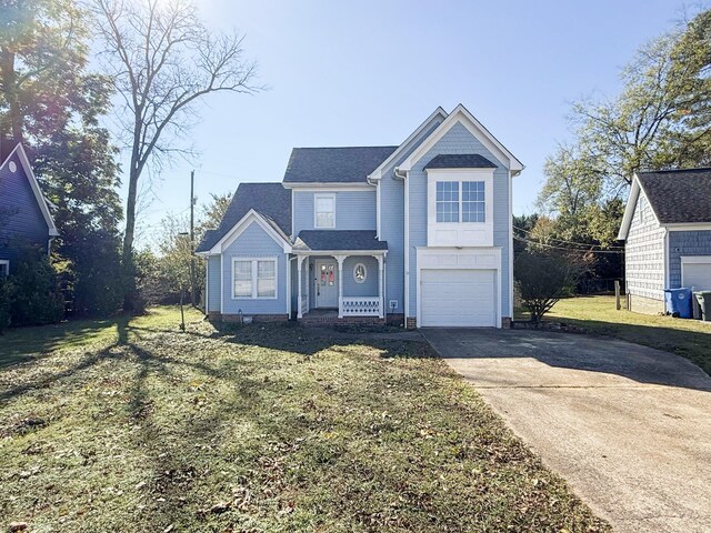 front of property featuring a front lawn and a garage