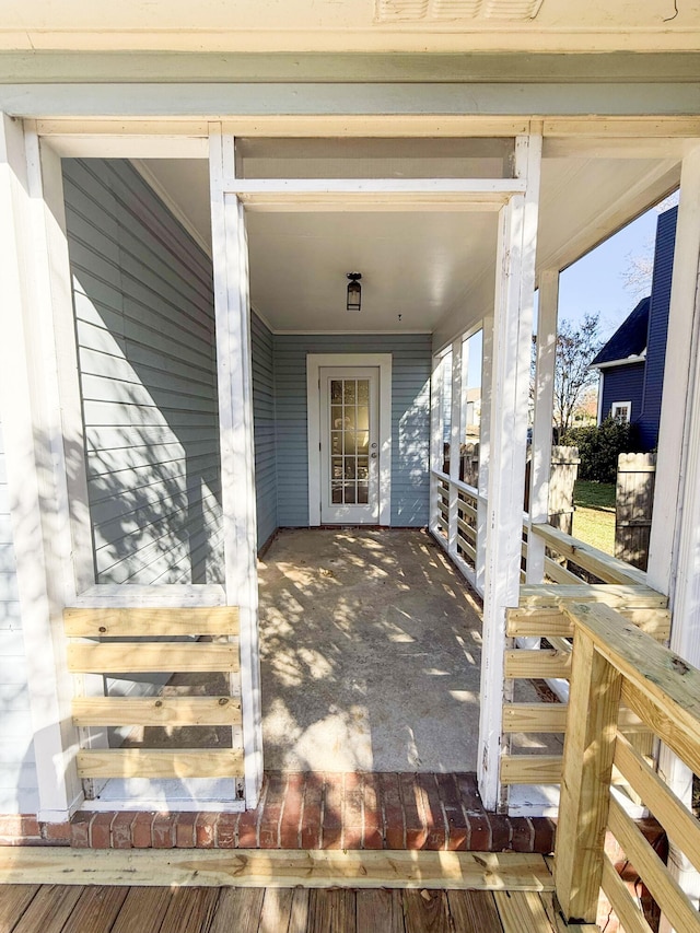 doorway to property featuring covered porch