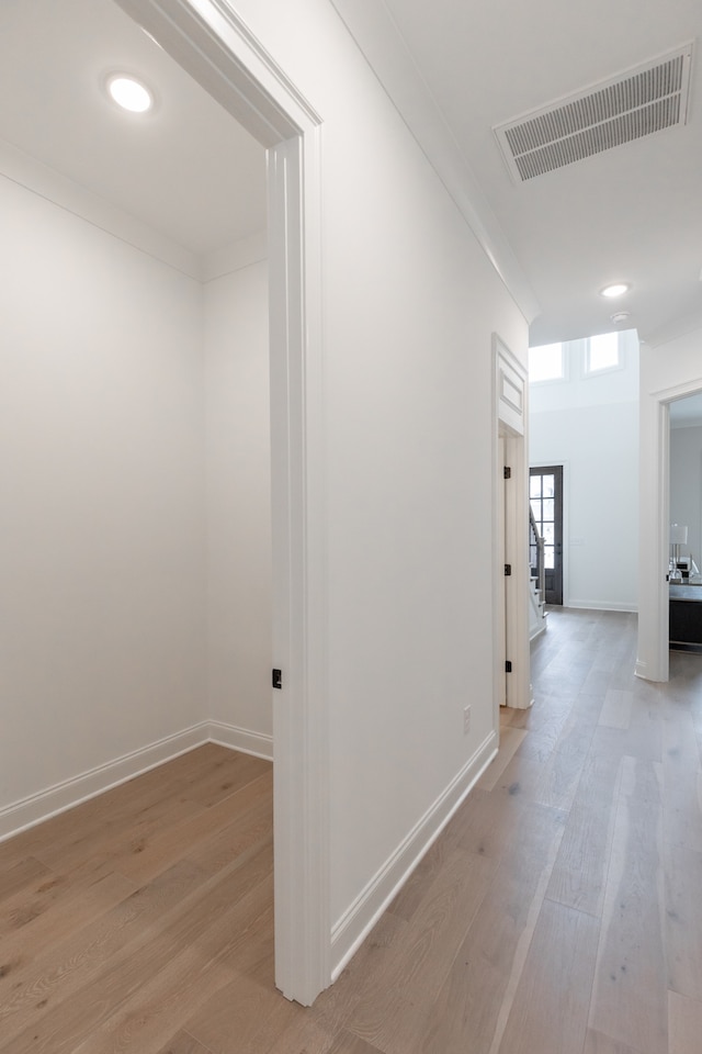 hall with light hardwood / wood-style floors