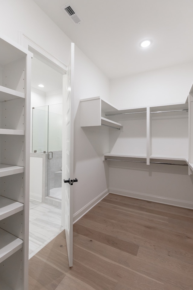 spacious closet with wood-type flooring