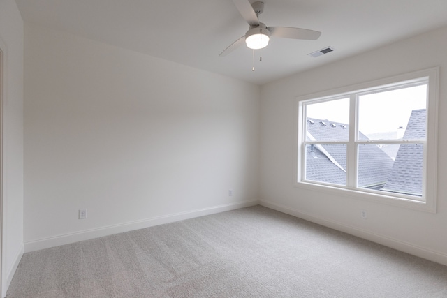 unfurnished room featuring ceiling fan and carpet floors