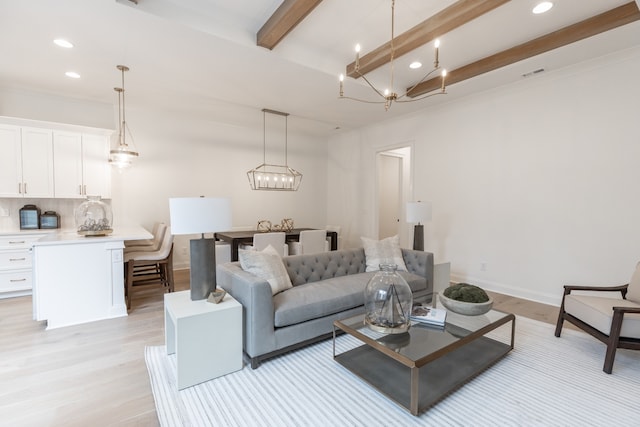 living room with beam ceiling and light hardwood / wood-style flooring