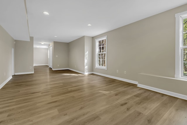 unfurnished room with hardwood / wood-style floors