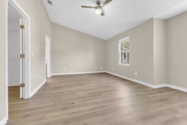 unfurnished room featuring vaulted ceiling, light hardwood / wood-style flooring, and ceiling fan