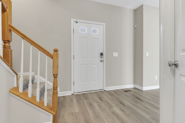 foyer with light wood-type flooring