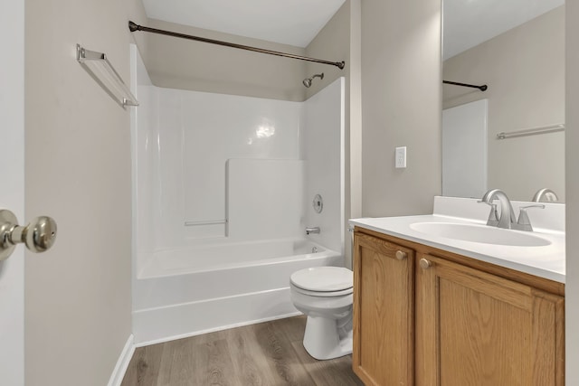 full bathroom with toilet, vanity, bathtub / shower combination, and hardwood / wood-style flooring