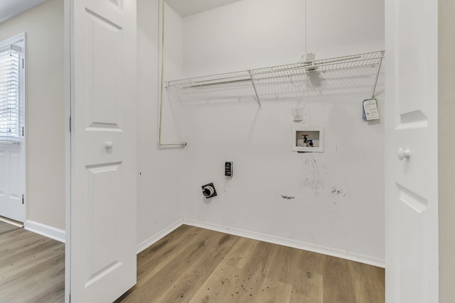 washroom with hookup for an electric dryer, light wood-type flooring, and hookup for a washing machine