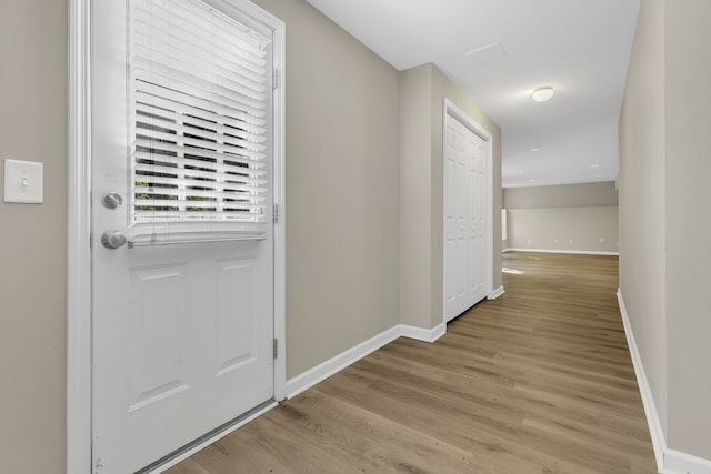 doorway with light hardwood / wood-style flooring