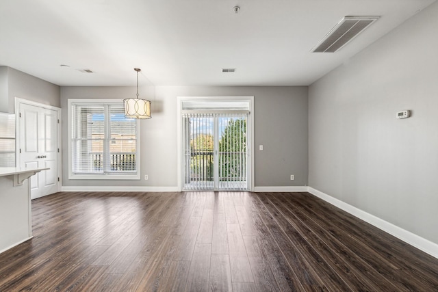 3200 Long Blvd Unit 4, Nashville, TN 37203 - unfurnished dining area with baseboards and dark wood-type flooring