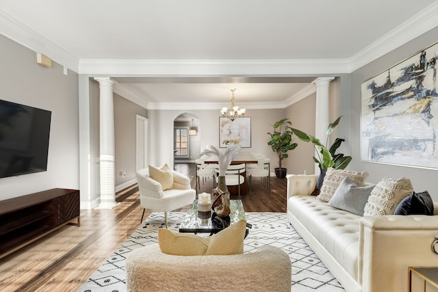 3200 Long Blvd Unit 4, Nashville, TN 37203 - living room with a chandelier, light hardwood / wood-style floors, ornate columns, and crown molding