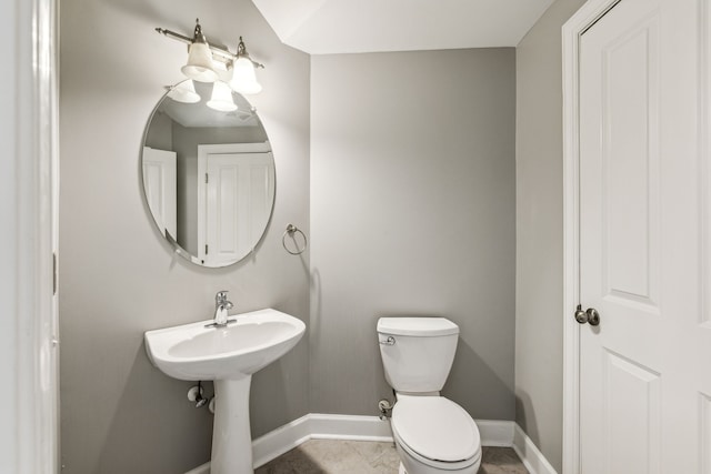 bathroom featuring tile patterned floors and toilet