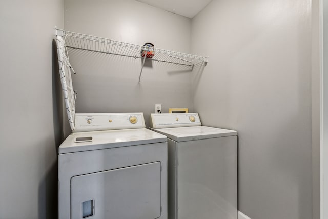 laundry room with separate washer and dryer