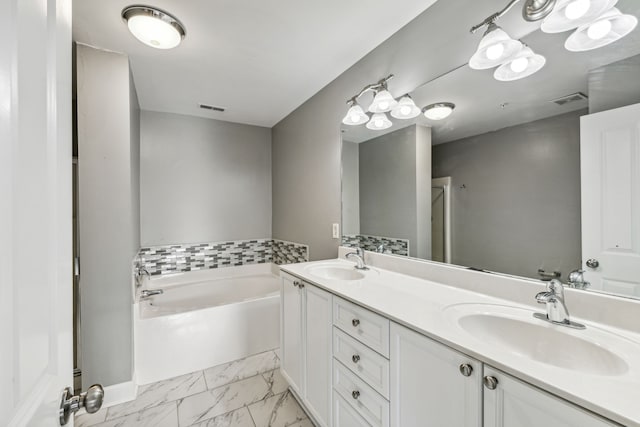 bathroom featuring a bathing tub and vanity