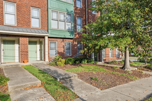 3200 Long Blvd Unit 4, Nashville, TN 37203 - view of front of house with brick siding and a standing seam roof