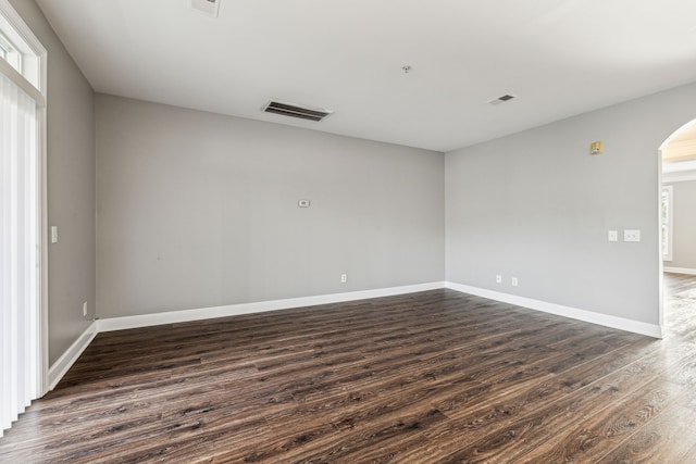 empty room featuring dark wood-type flooring