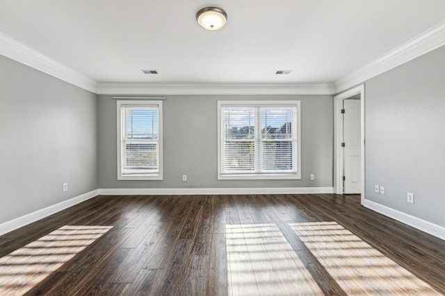 empty room with crown molding and dark wood-type flooring